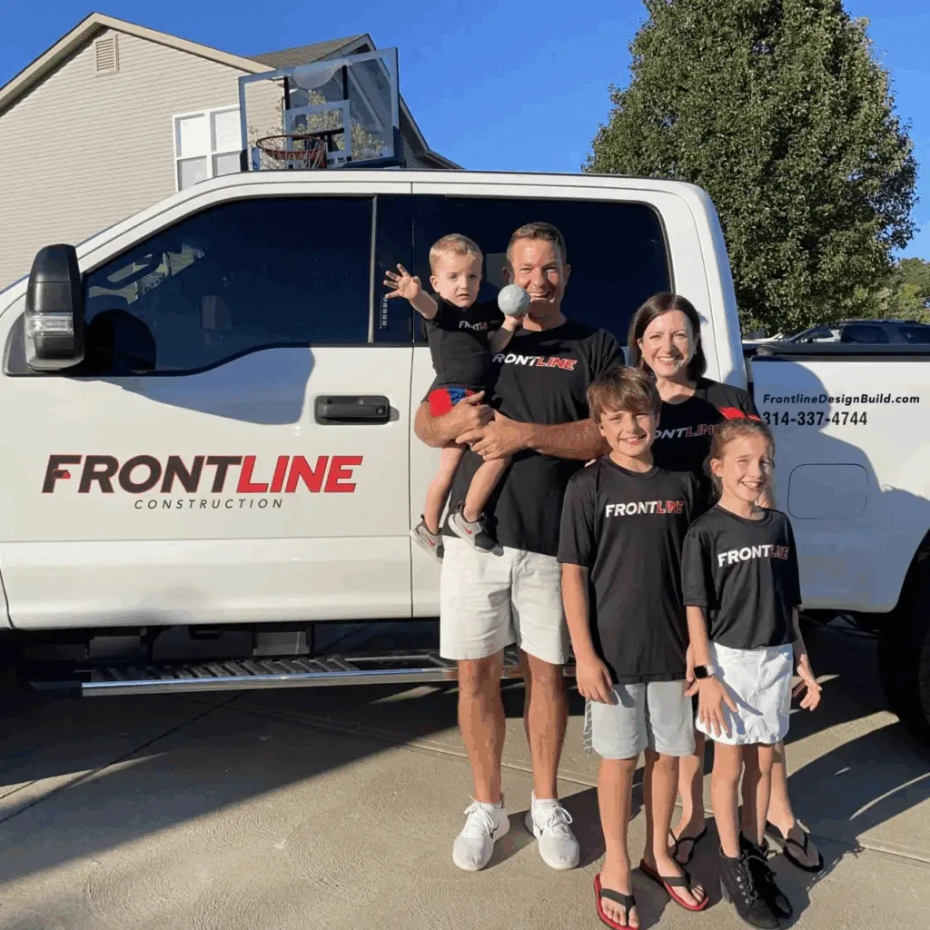 Todd Mayer and his family in front of the Frontline Construction truck